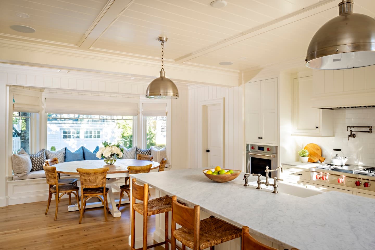 Modern kitchen with light colors and stainless steel appliances