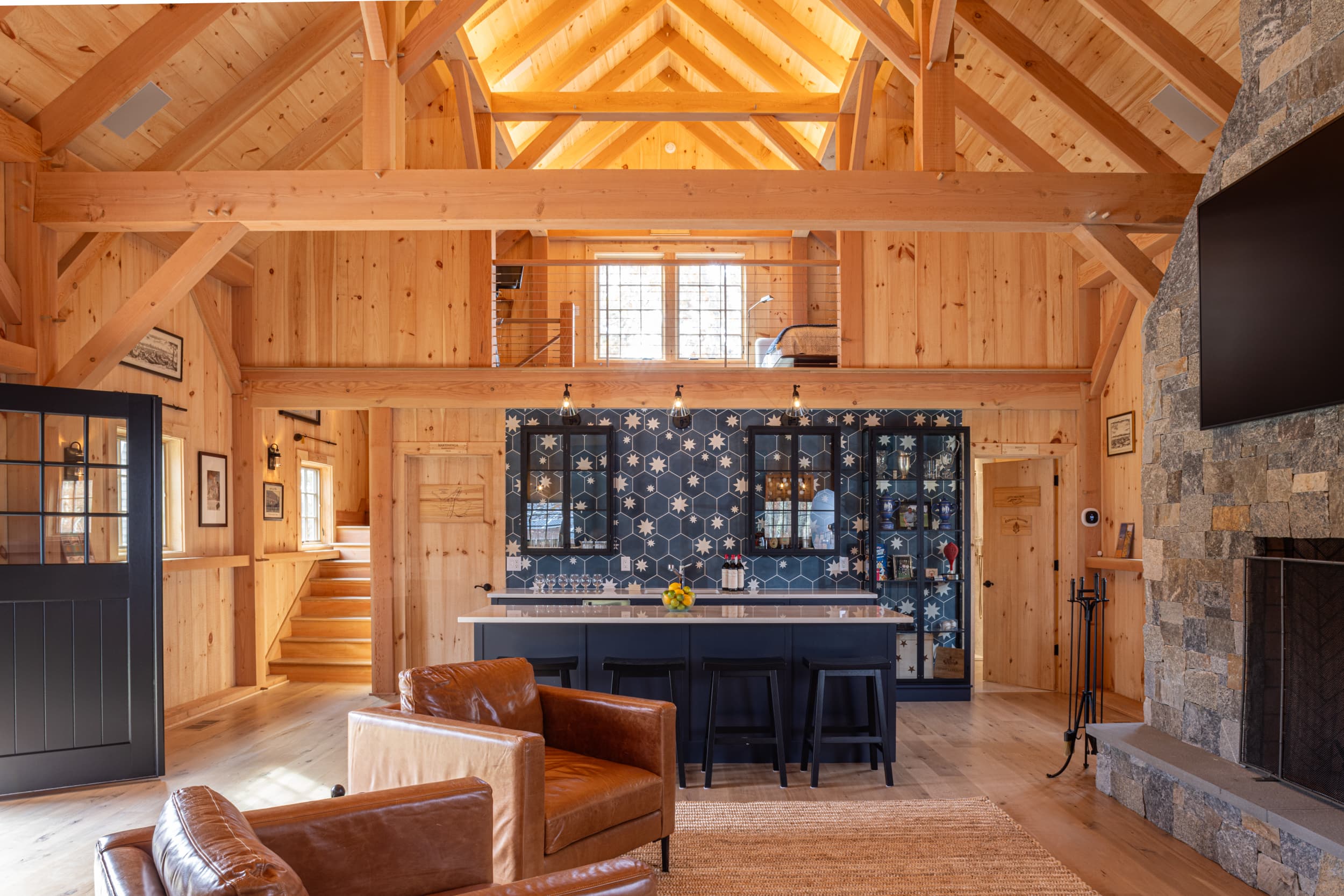 Interior view of the Amish barn with a bar and golf simulator