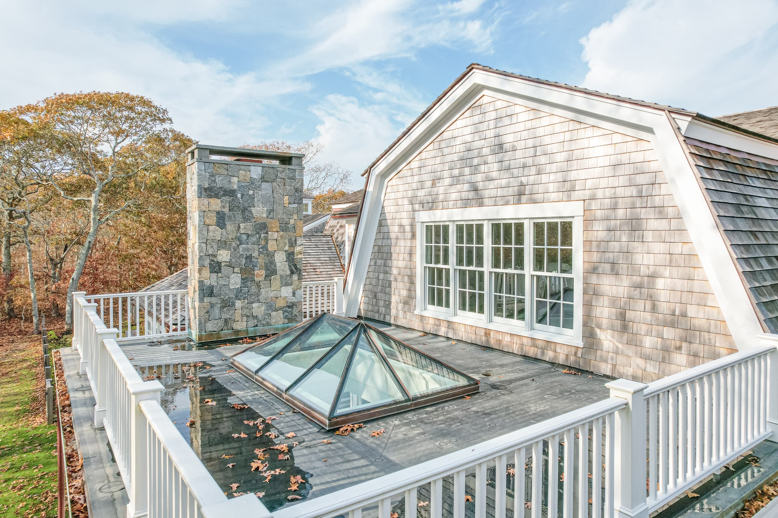 Exterior view of the conservatory with glass walls and roof