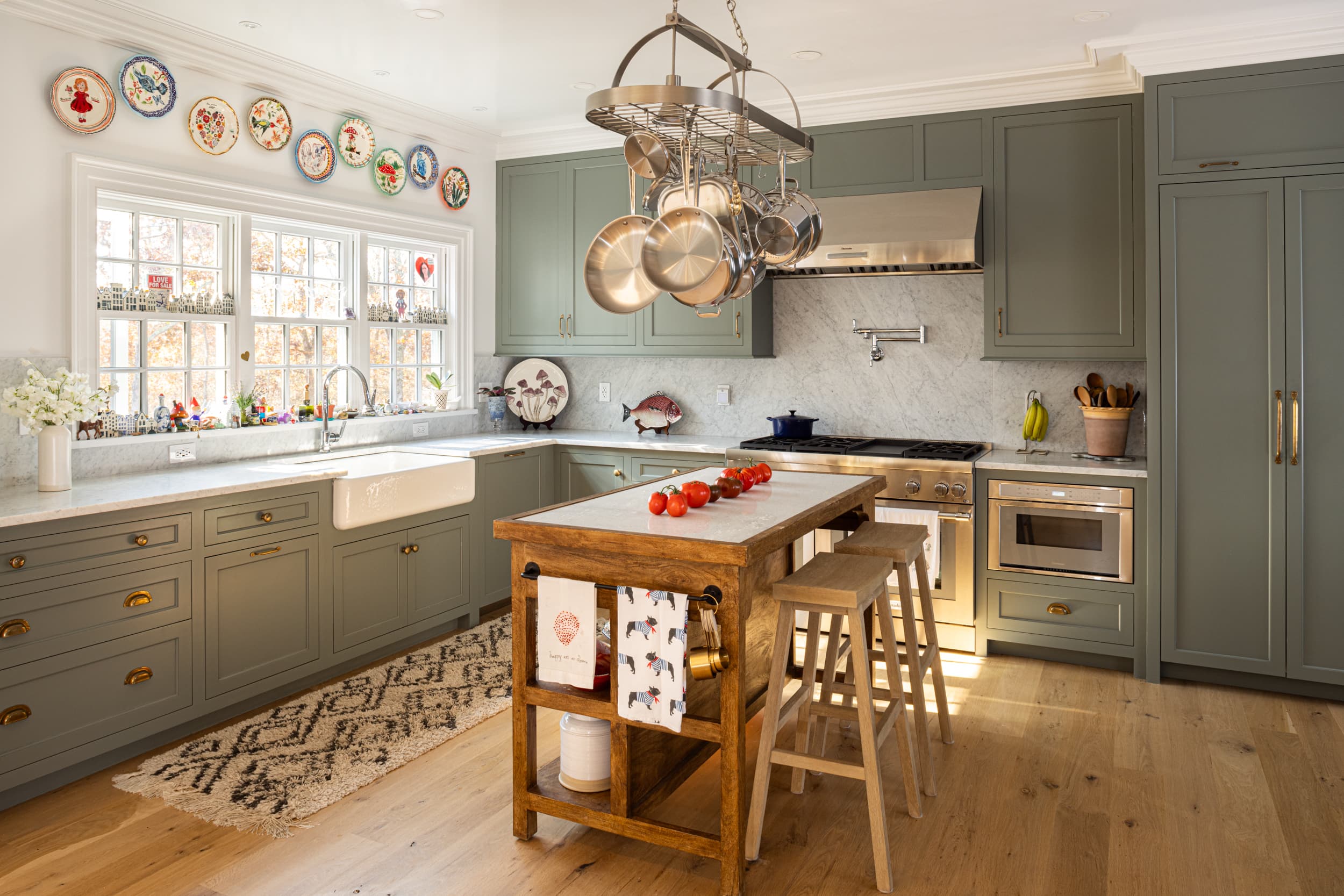 Kitchen with island, sink, stove, fridge, and island